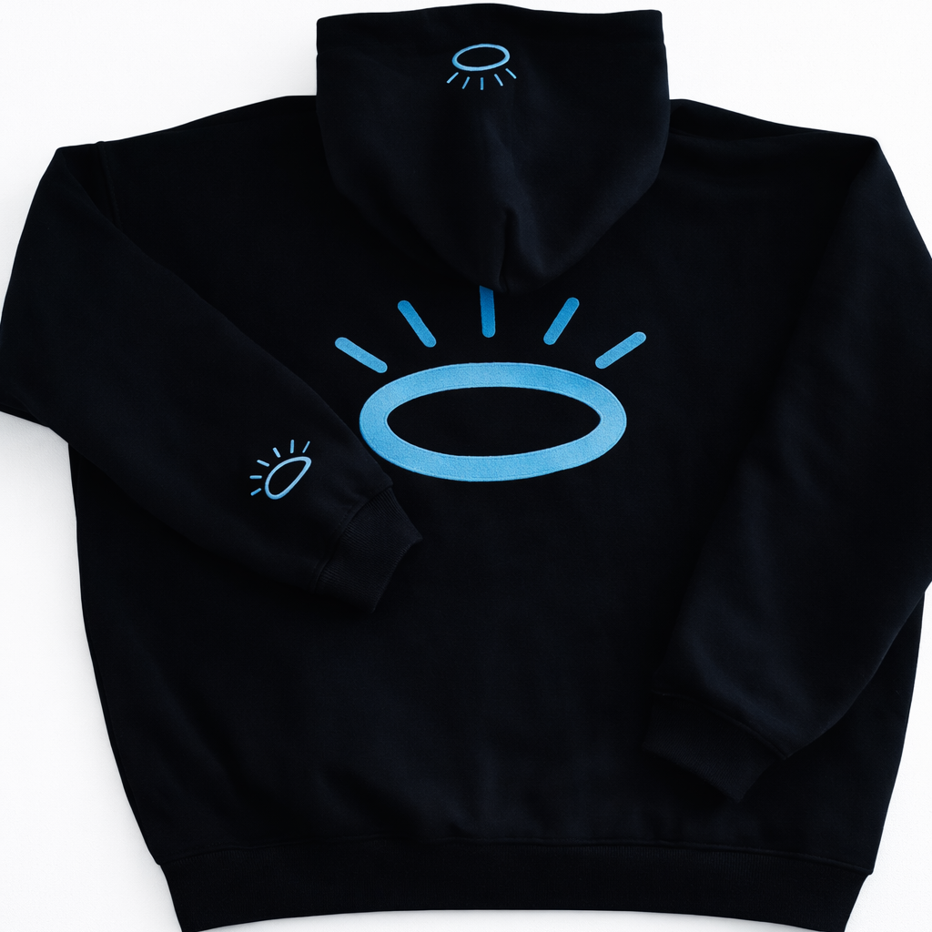 Back view of jet black sweatshirt featuring flat woven Tatami embroidery halo in vibrant Tahoe Blue. Halo on hood and sleeve. 
