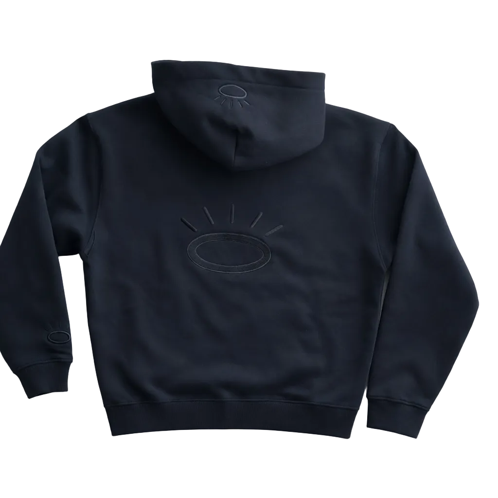 Back view of jet black sweatshirt featuring flat woven black Tatami embroidered halo on back, sleeve and hood. 
