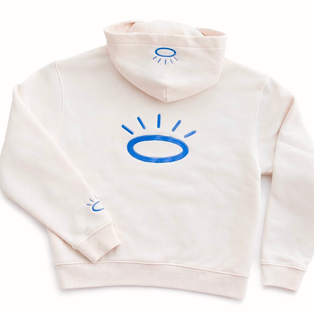 Back view of cream sweatshirt featuring flat woven Tatami embroidery halo logo in Tahoe Blue.
